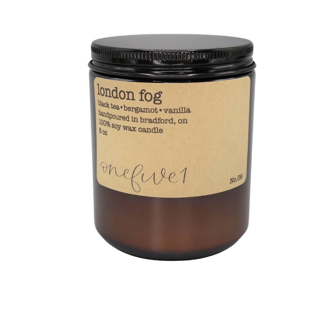 Candle labeled 'London Fog' with a black lid on a white background