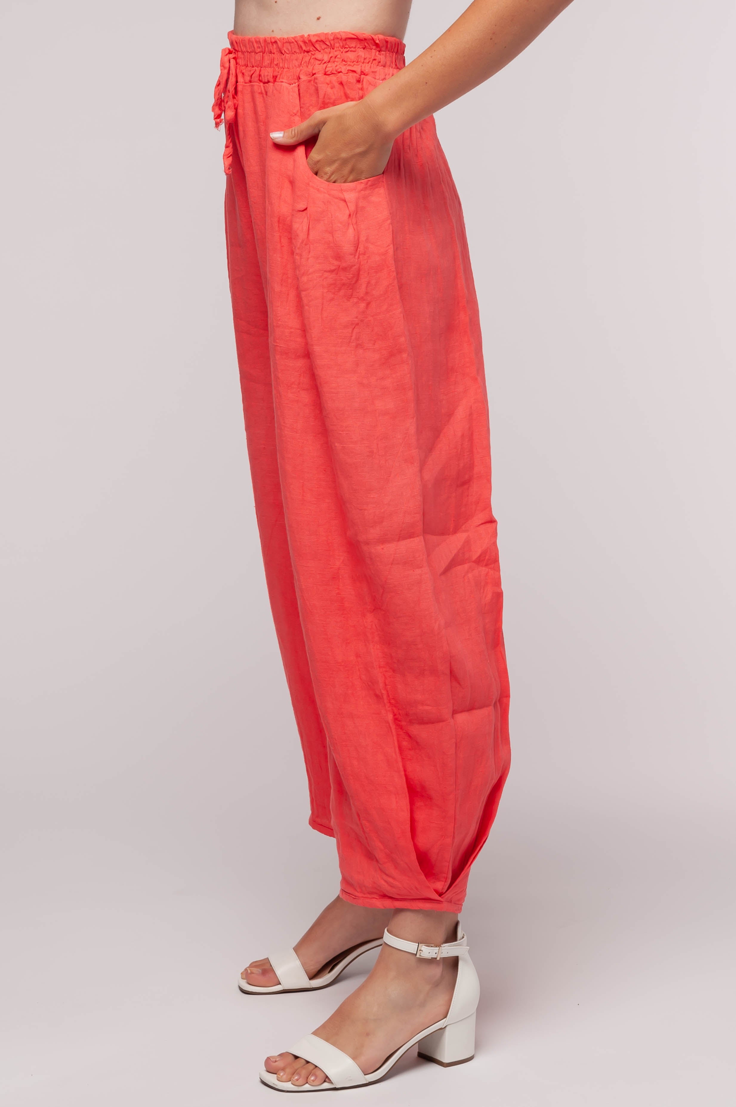 Ladies linen clothing for spring and summer featuring a wide leg pant with elastic waist and pockets.