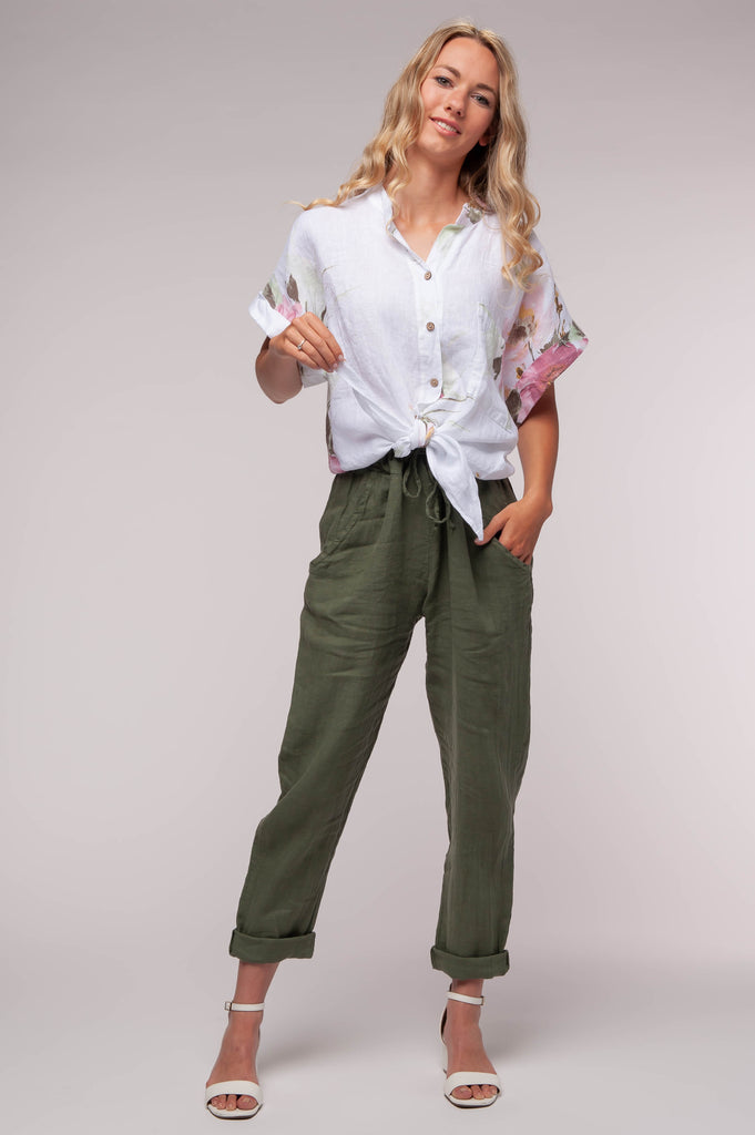 Ladies linen clothing for spring and summer featuring a floral sleeve button up shirt with knot
