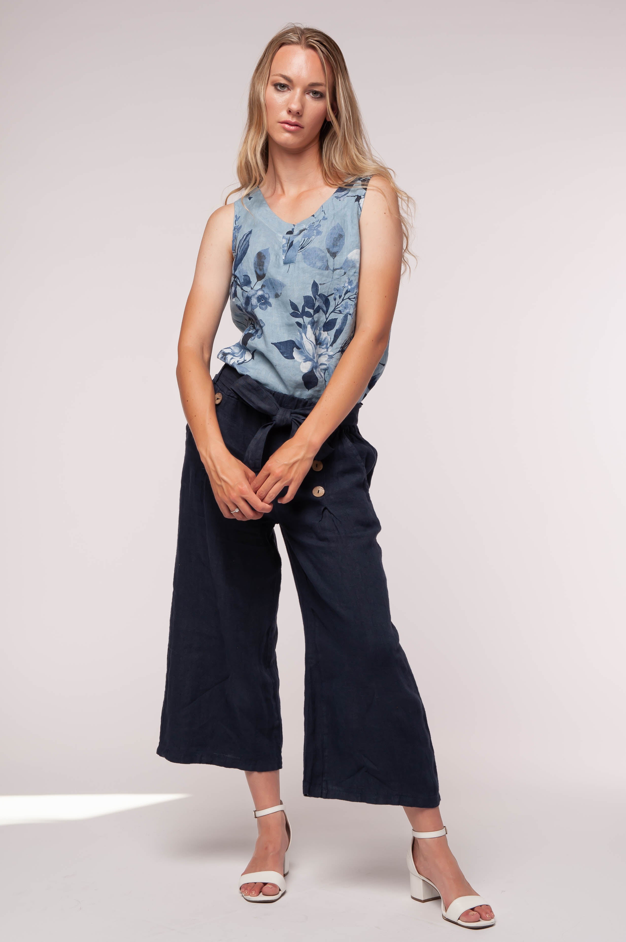 Ladies linen clothing for spring and summer featuring a floral tank top shirt