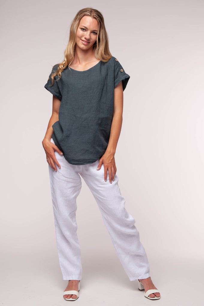 Ladies linen clothing for spring and summer featuring a solid coloured top with buttons on shoulder