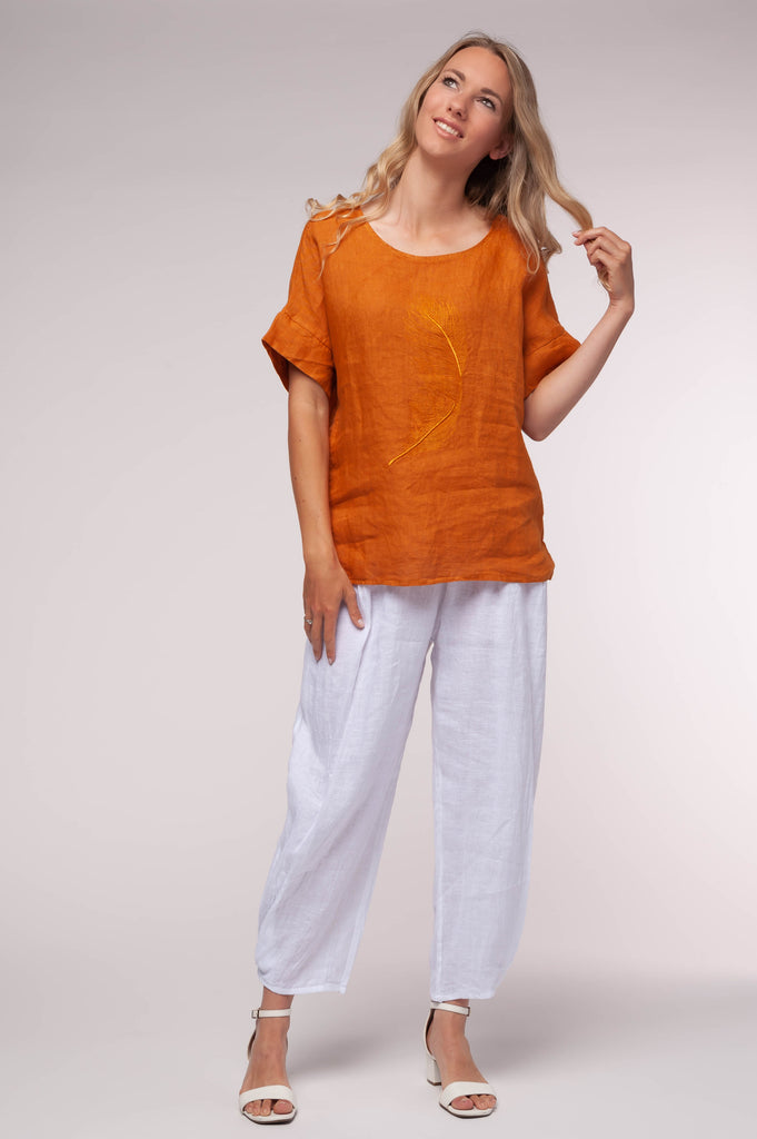 Ladies linen clothing for spring and summer featuring a t-shirt with an embroidered feather on front