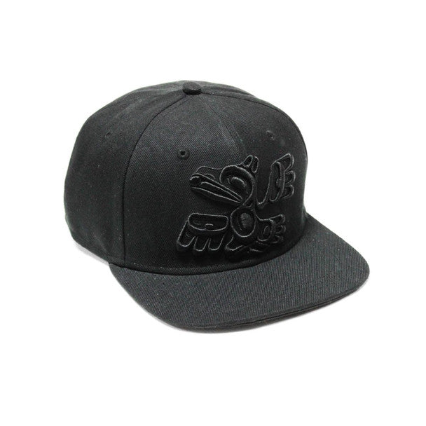 Streetwear style snapback hat featuring Indigenous artwork, 100% cotton twill (raven design)