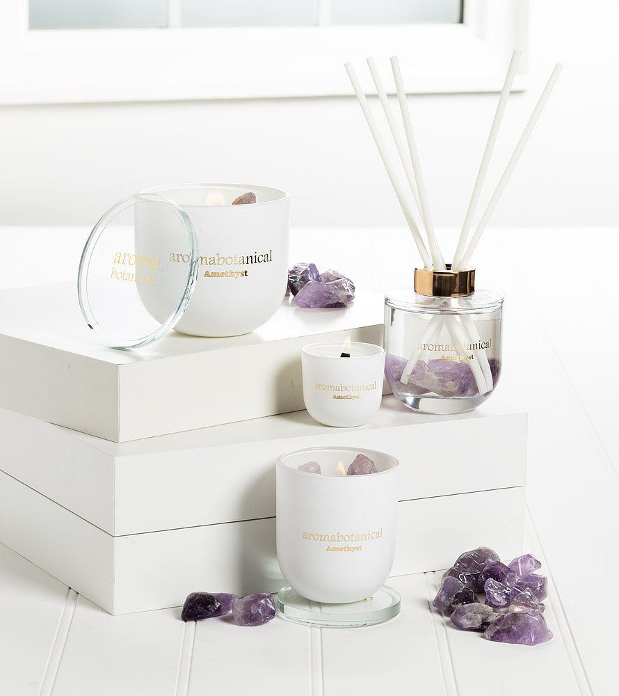 Amethyst scented candle with crystal rocks, burn the candle to receive the crystal.