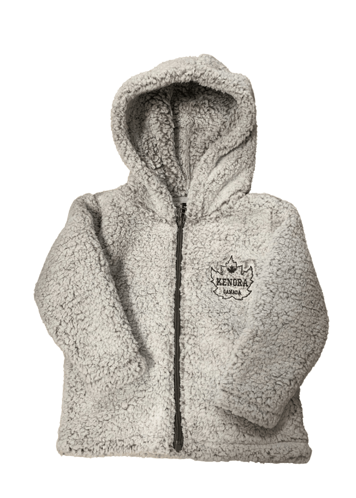 Featuring a cozy youth hooded sherpa zip up burbur with Kenora, Canada written inside a maple leaf on the right chest