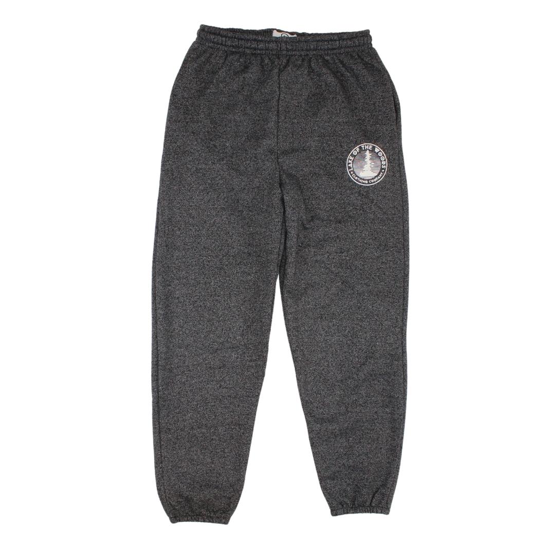A pair of dark grey sweatpants with a Lake of the Woods Clothing Company logo design printed on the top left front leg. These sweatpants are made in Canada and are fit for men and women