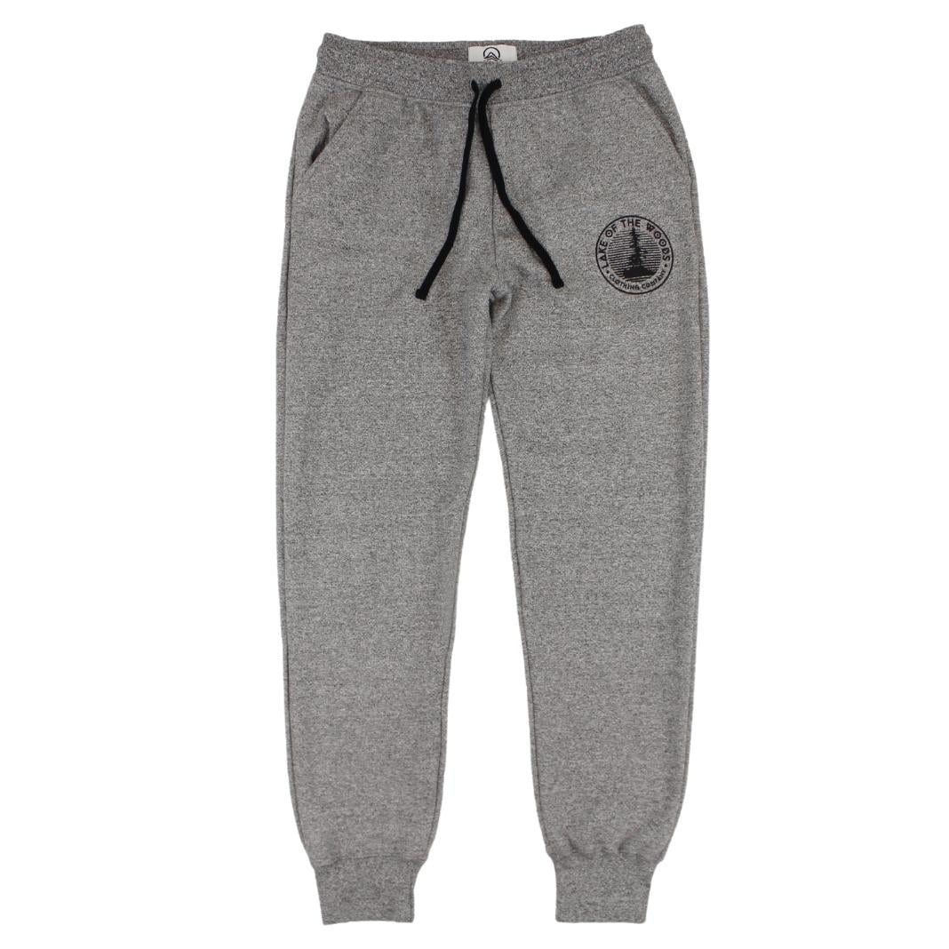 A pair of dark grey sweatpants with a Lake of the Woods Clothing Company logo design printed on the top left front leg. These sweatpants are made in Canada and are fit for women.