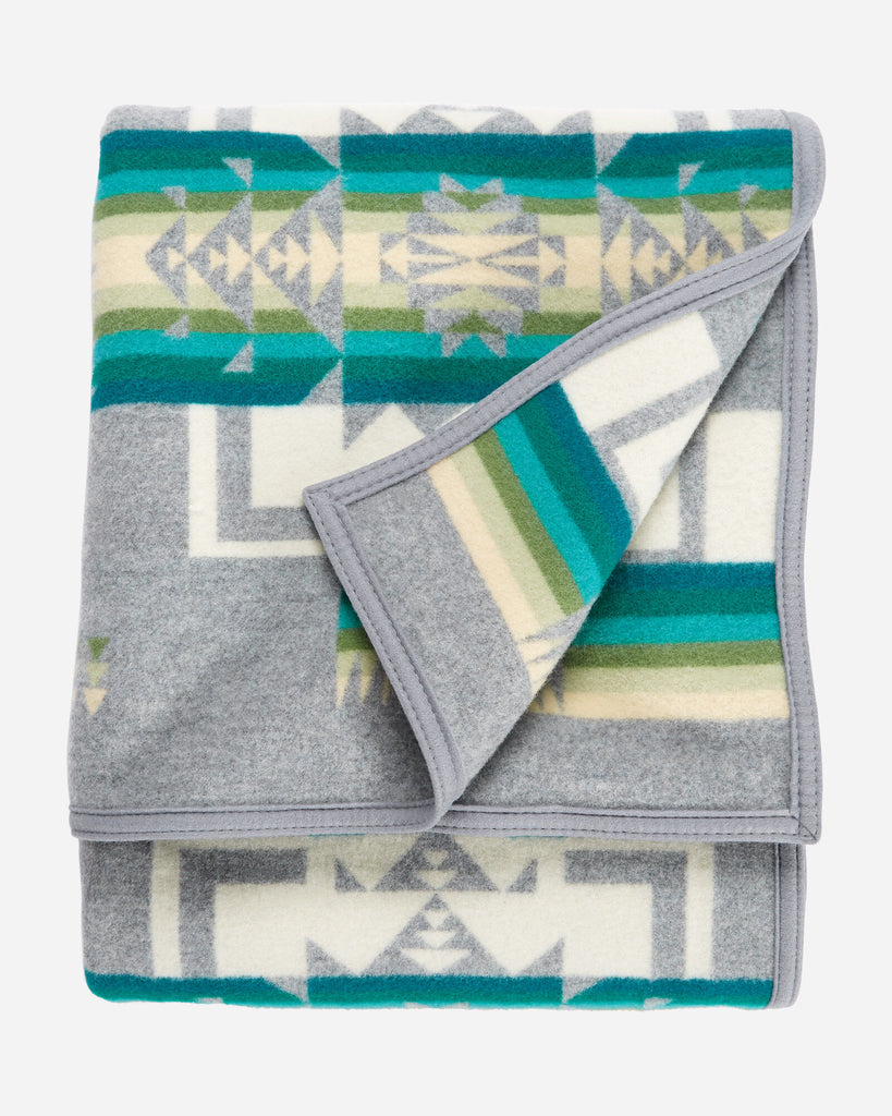 twin size reversible Pendleton wool blanket in grey with a bold arrowhead designrage, strength and integrity
