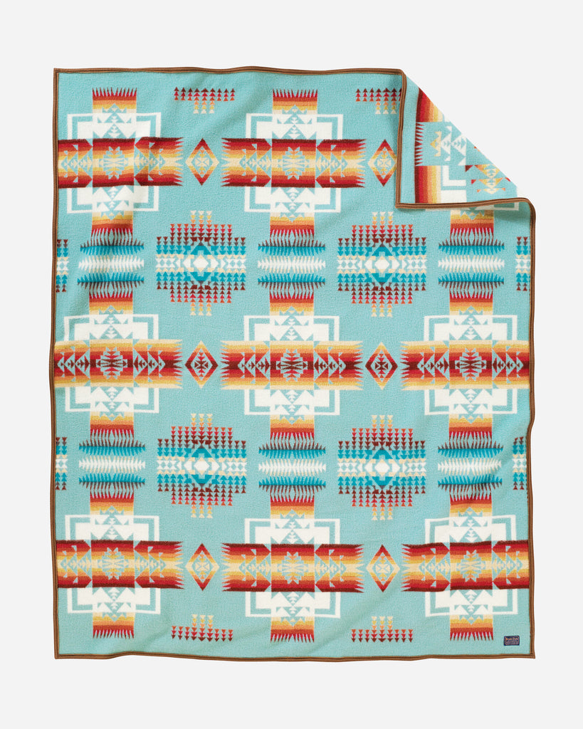 twin size reversible Pendleton wool blanket in aqua with a bold arrowhead design