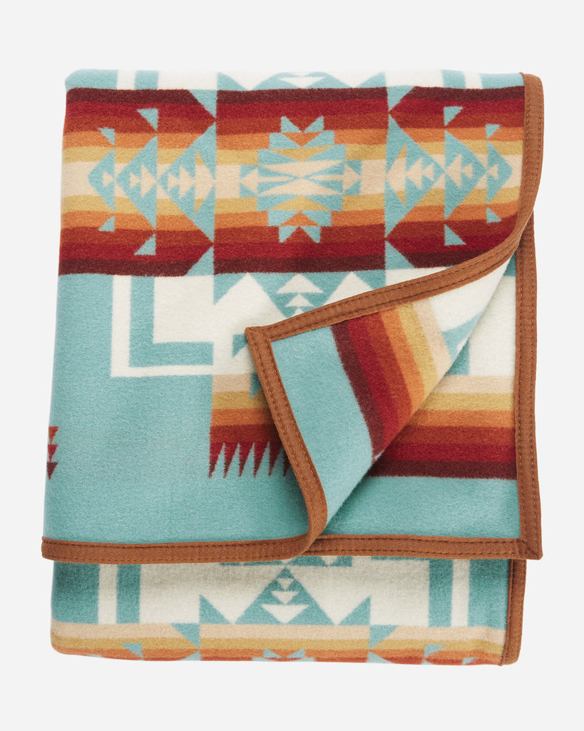 twin size reversible Pendleton wool blanket in aqua with a bold arrowhead design