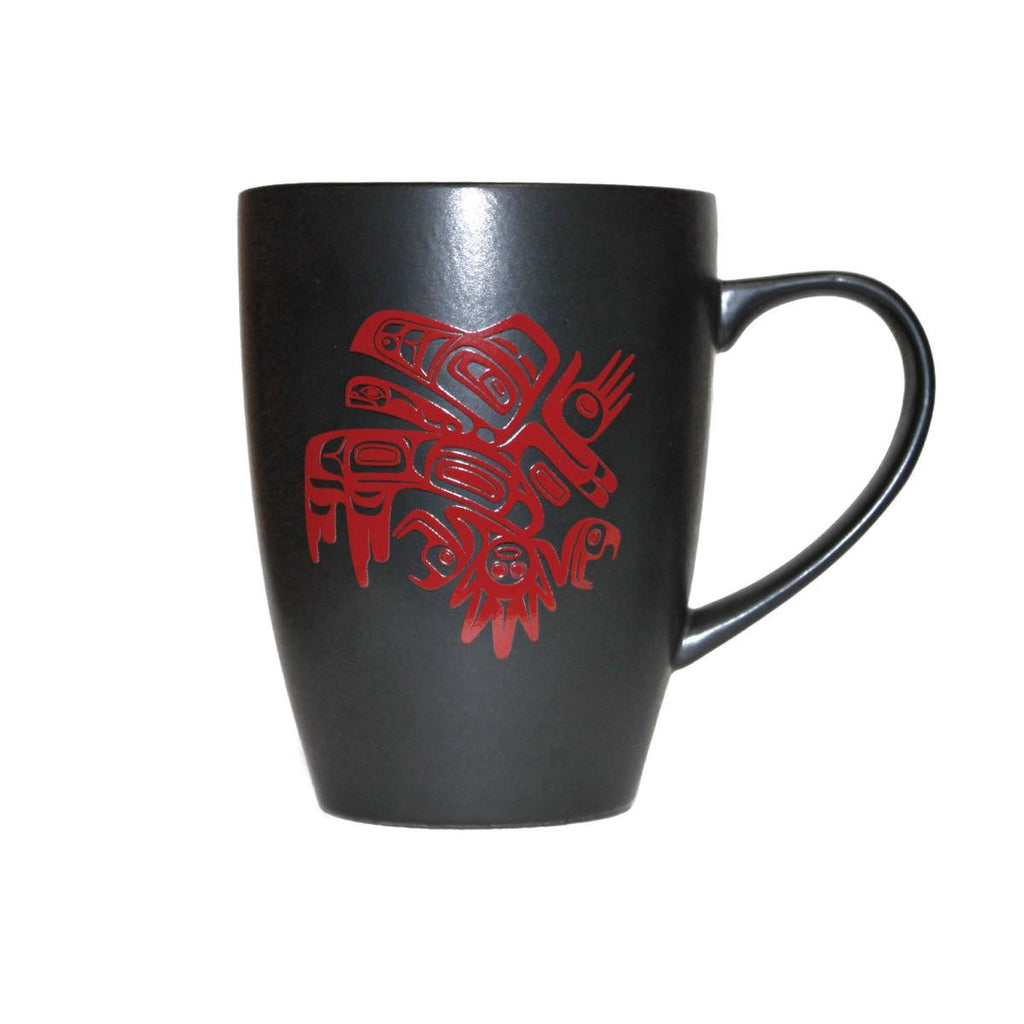 Black ceramic mug with a coloured image of an Indigenous designed raven.