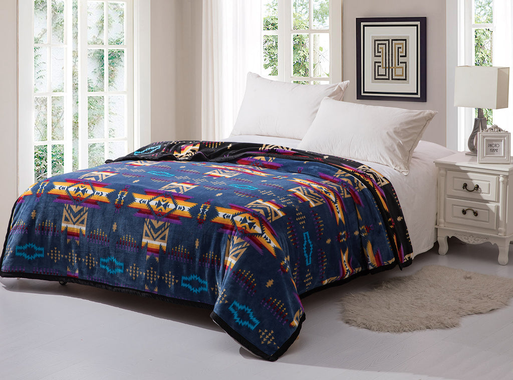 Blue reversible to black fleece blanket with traditional native designs. Comes in twin, queen, and king.