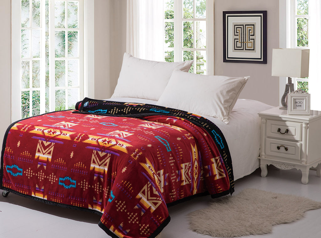 Burgundy reversible to black fleece blanket with traditional native designs. Comes in twin, queen, and king.