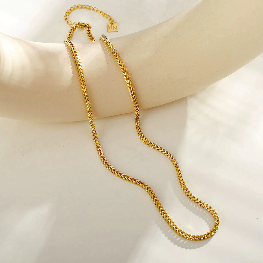 Hackney jewelry featuring a delicate gold paperclip chain bracelet.