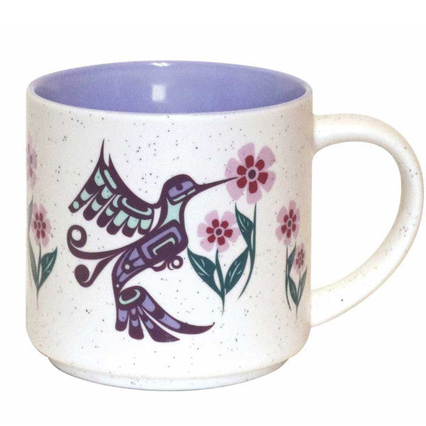 A ceramic coffee mug featuring an Indigenous design of eagles from the Bella Bella tribe