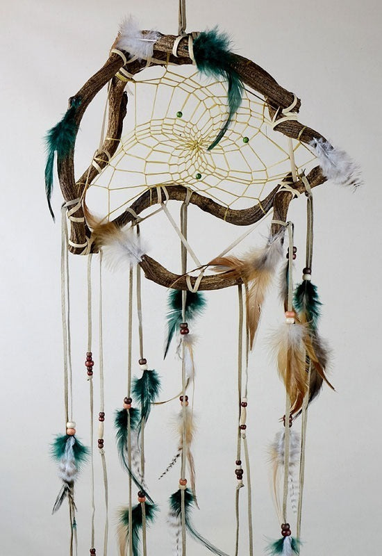 12" The Wanderer Dream Catcher with green feathers. Twig sizes will vary due to the organic nature of the material.