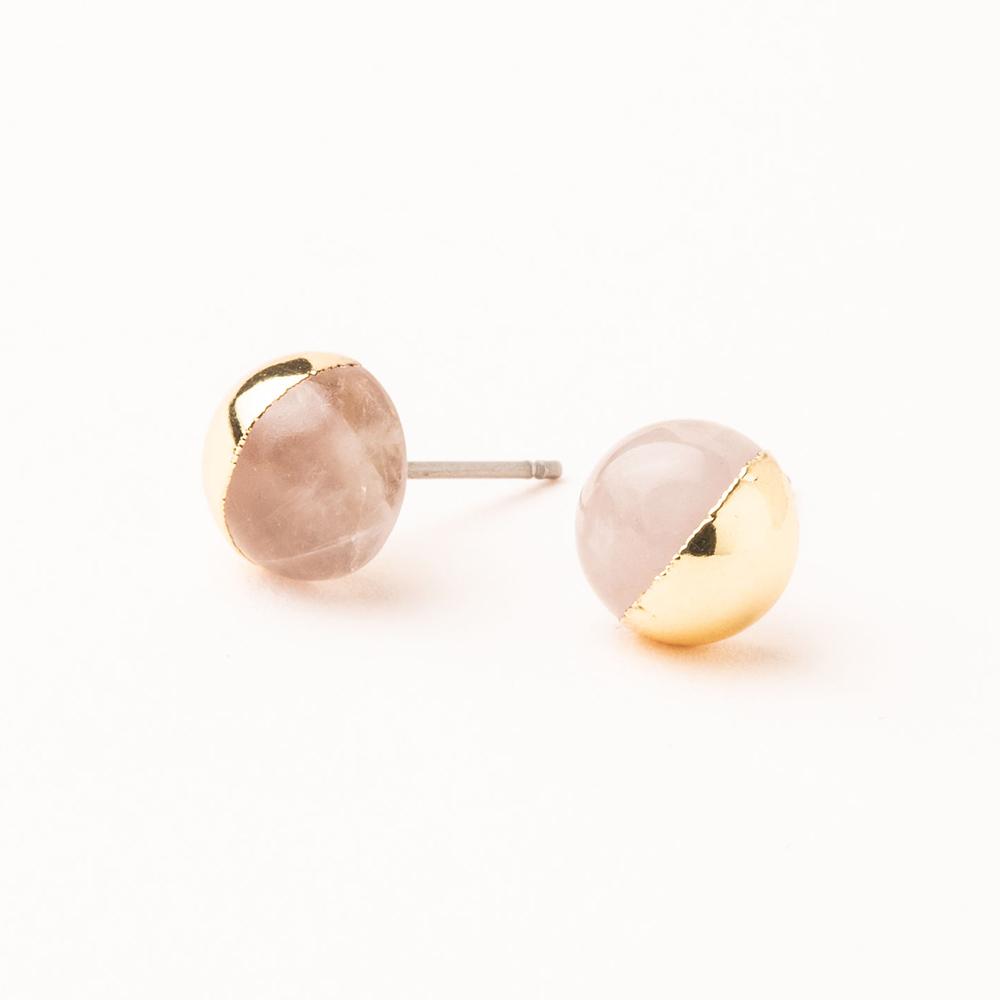 Scout jewelry featuring a pair of stud earrings