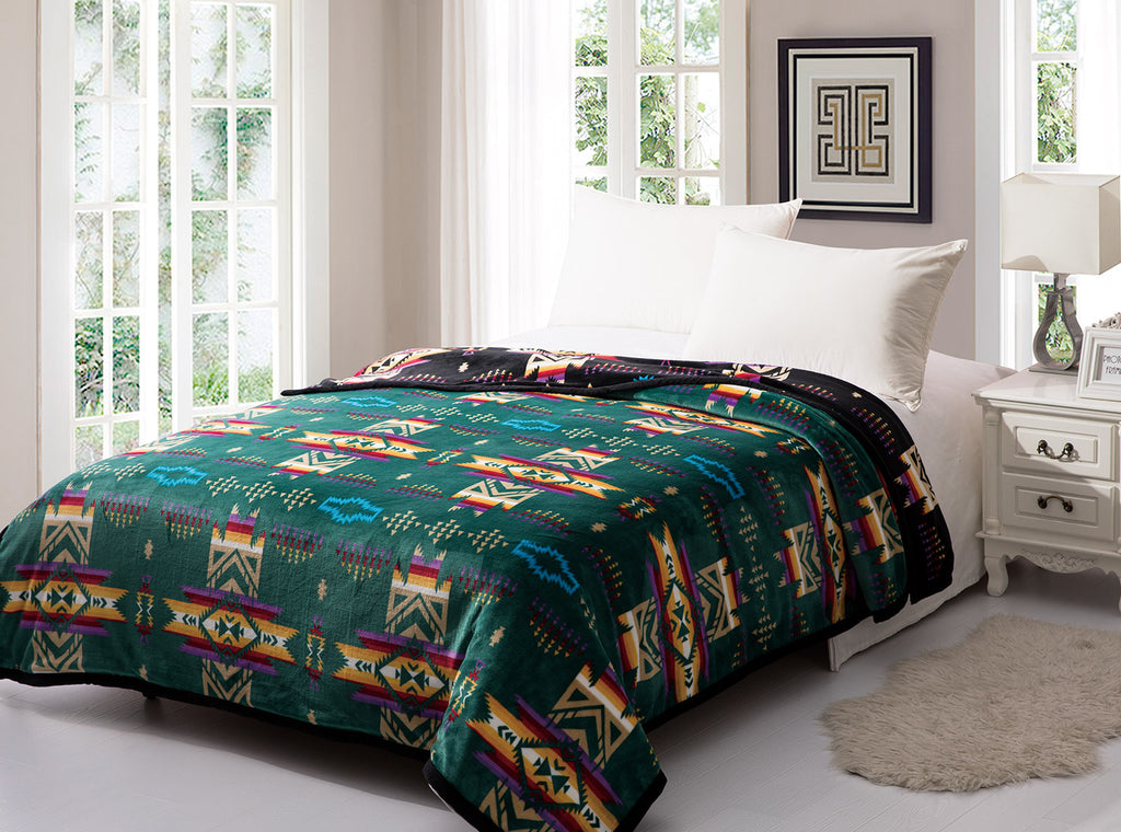 Green reversible to black fleece blanket with traditional native designs. Comes in twin, queen, and king.