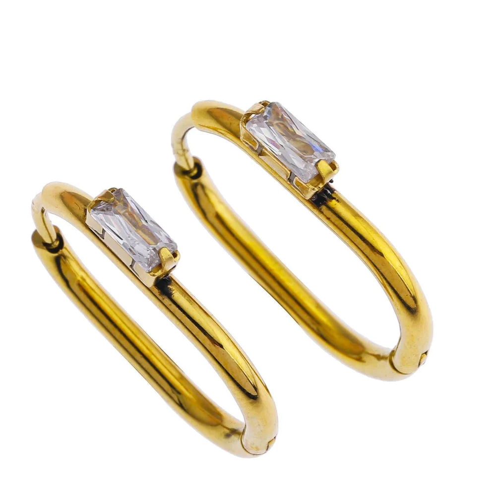 Hackney jewelry featuring a pair of gold hoop earrings with a solitaire rectangle zirconia.