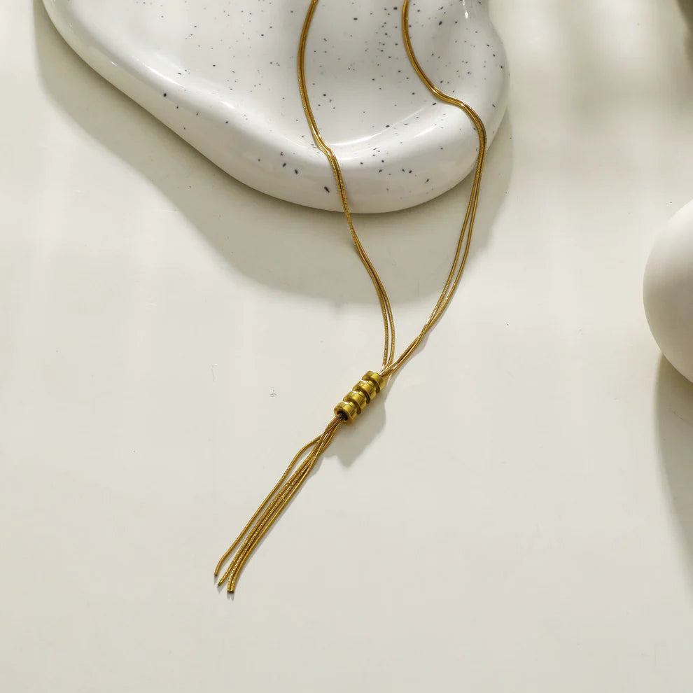 Hackney jewelry featuring a multi stranded gold necklace