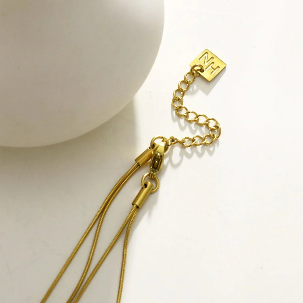 Hackney jewelry featuring a multi stranded gold necklace