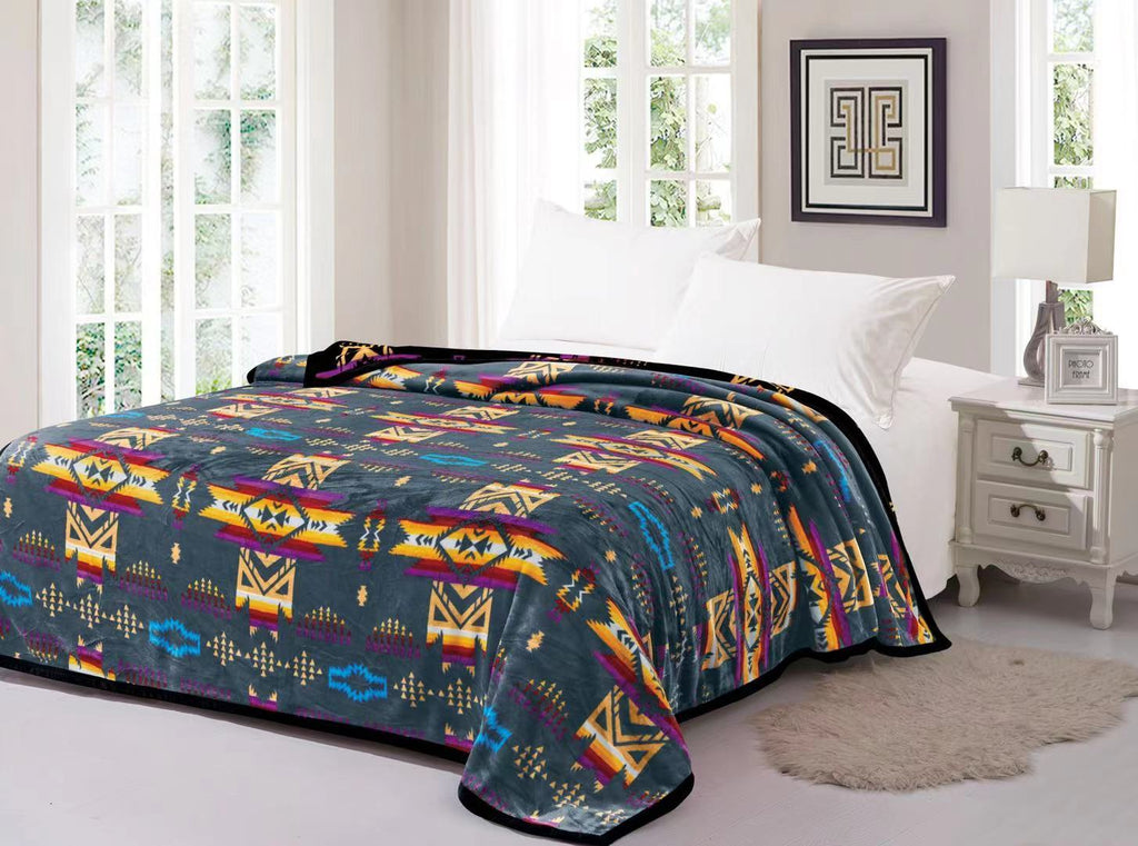 Charcoal reversible to black fleece blanket with traditional native designs. Comes in twin, queen, and king.