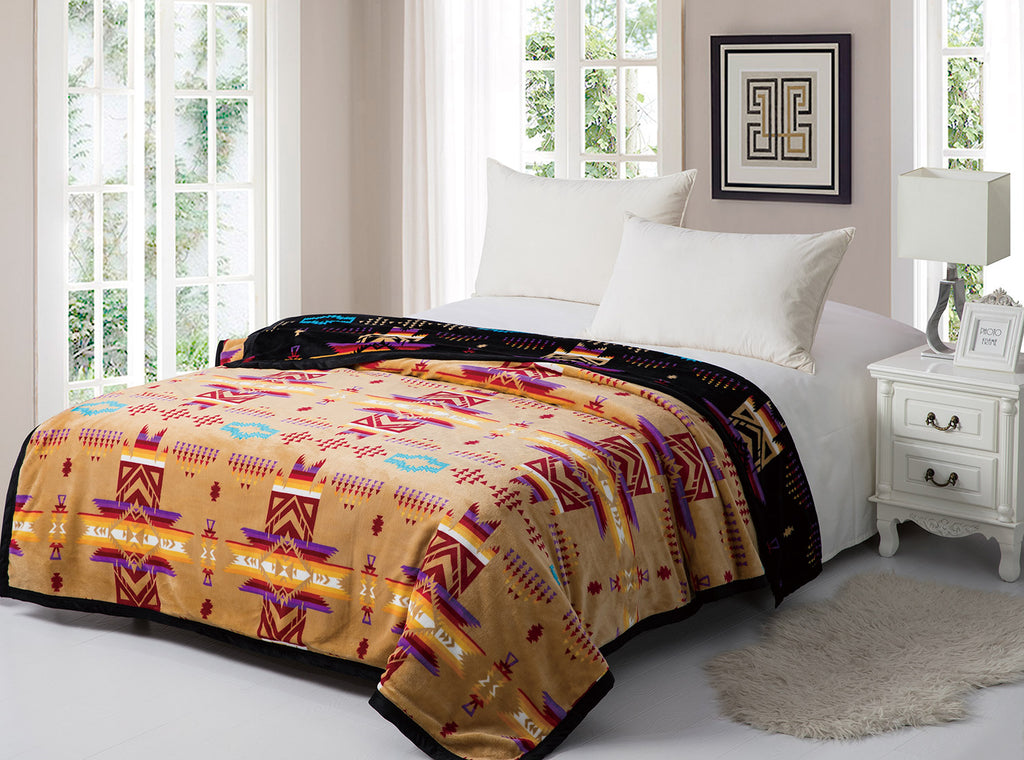 Tan reversible to black fleece blanket with traditional native designs. Comes in twin, queen, and king.