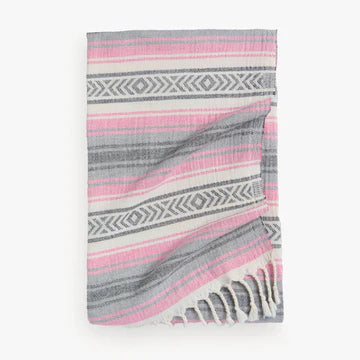 The Coastline towel is an easy choice with its vintage-inspired design with vibrant color story for anyone and everyone you know! Extra-soft handfeel, no crispiness, gets softer with use. Roll up to fit easily into a travel bag or for yoga. Made with pure Turkish cotton in a fair trade environment.