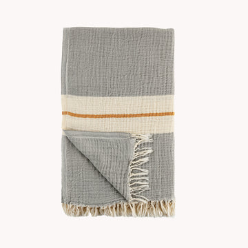 The Coastline towel is an easy choice with its vintage-inspired design with vibrant color story for anyone and everyone you know! Extra-soft handfeel, no crispiness, gets softer with use. Roll up to fit easily into a travel bag or for yoga. Made with pure Turkish cotton in a fair trade environment.