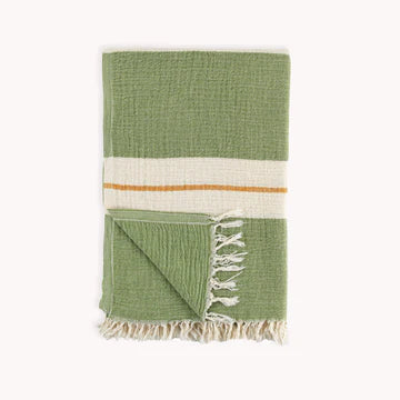 The Coastline towel is an easy choice with its vintage-inspired design with vibrant color story for anyone and everyone you know! Extra-soft handfeel, no crispiness, gets softer with use. Roll up to fit easily into a travel bag or for yoga. Made with pure Turkish cotton in a fair trade environment.