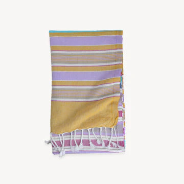 This pure turkish cotton towel is middle-weight and super absorbent to dry off beach or poolside. Folds compactly in your suitcase, ready for any destination. This towel measures larger than the typical towel. Use as a light throw, cover-up, and picnic blanket!