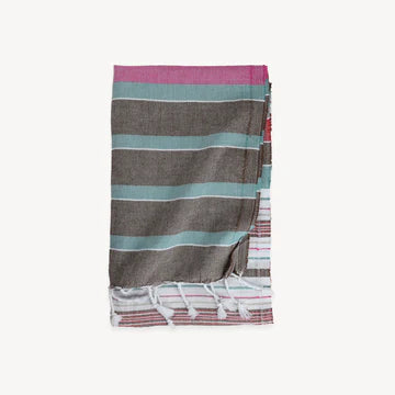 This pure turkish cotton towel is middle-weight and super absorbent to dry off beach or poolside. Folds compactly in your suitcase, ready for any destination. This towel measures larger than the typical towel. Use as a light throw, cover-up, and picnic blanket!