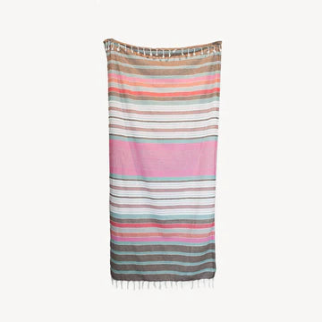 This pure turkish cotton towel is middle-weight and super absorbent to dry off beach or poolside. Folds compactly in your suitcase, ready for any destination. This towel measures larger than the typical towel. Use as a light throw, cover-up, and picnic blanket!