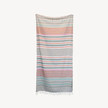 This pure turkish cotton towel is middle-weight and super absorbent to dry off beach or poolside. Folds compactly in your suitcase, ready for any destination. This towel measures larger than the typical towel. Use as a light throw, cover-up, and picnic blanket!