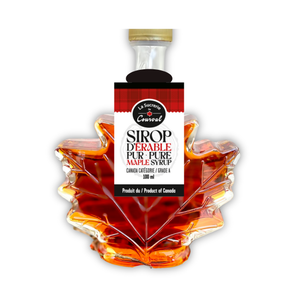 Pure Canadian made maple syrup in a glass Maple leaf shaped bottle