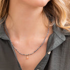 Cylindrical semi-precious stone beads and glittering metallic tubes are finished effortlessly with a faceted teardrop. Perfect for stacking and layering. Wear as a necklace or wrap as a bracelet.