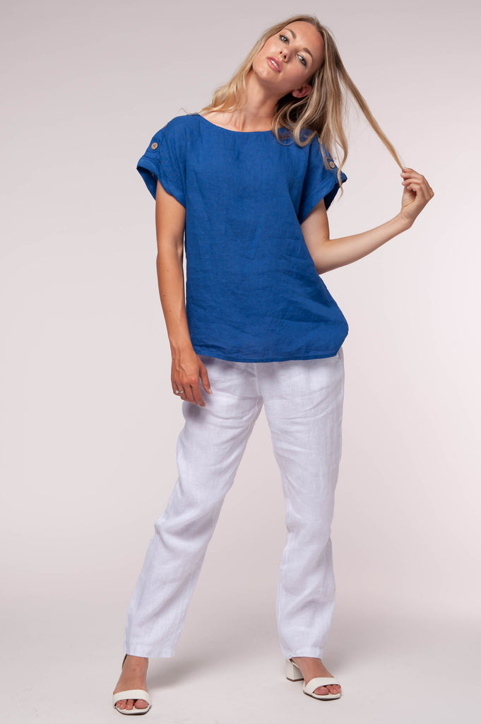 Ladies linen clothing for spring and summer featuring a solid coloured top with buttons on shoulder