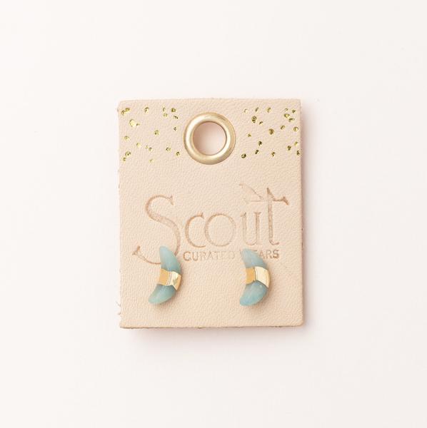 Scout jewelry featuring a pair of stud earrings