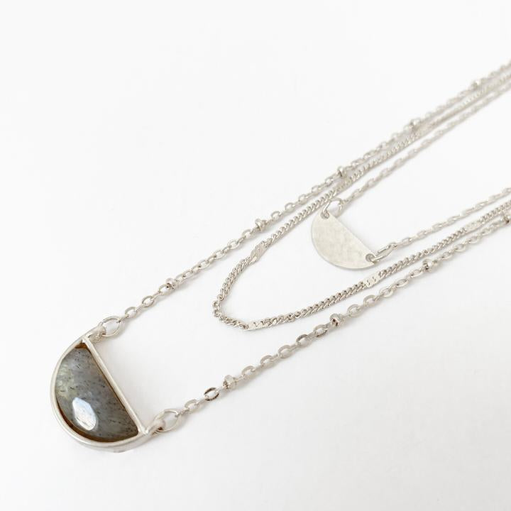 Caracol jewelry featuring a triple chain necklace with labradorite stone pendant