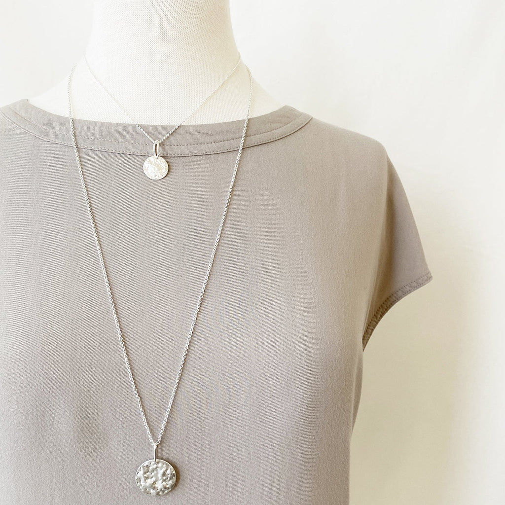 Caracol jewelry featuring a double chain with pendant necklace