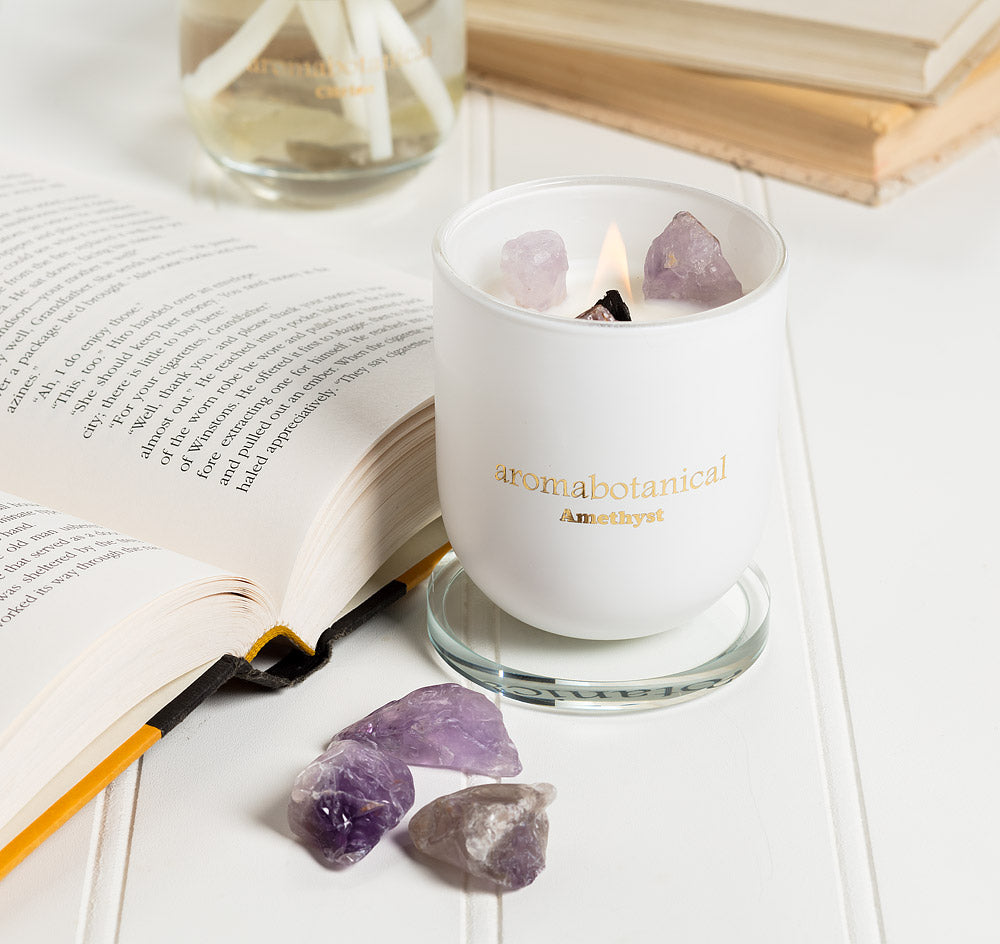 Amethyst scented candle with crystal rocks, burn the candle to receive the crystal. 