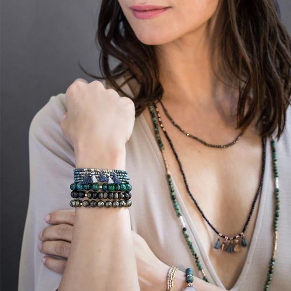 Scout jewelry featuring an elastic bracelet with beads