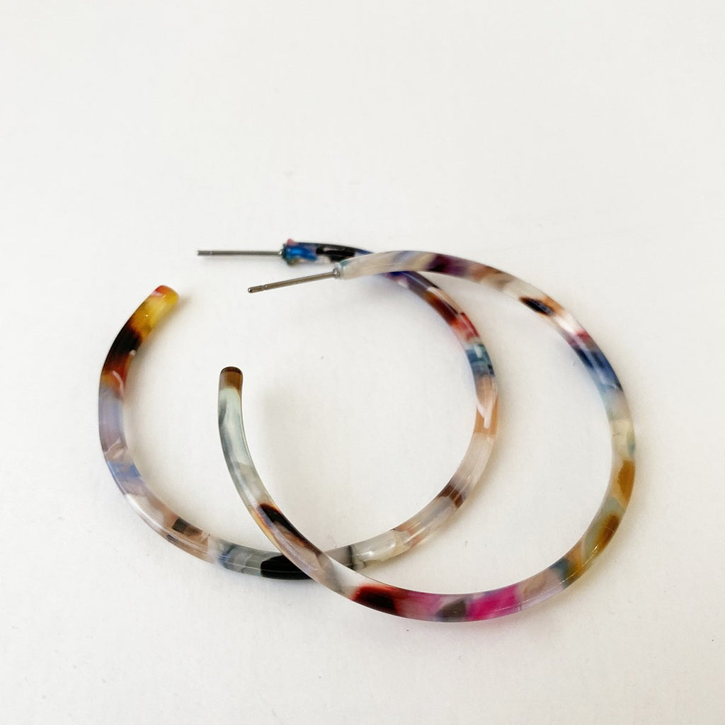 Caracol jewelry featuring a pair of medium sized multi coloured hoop earrings