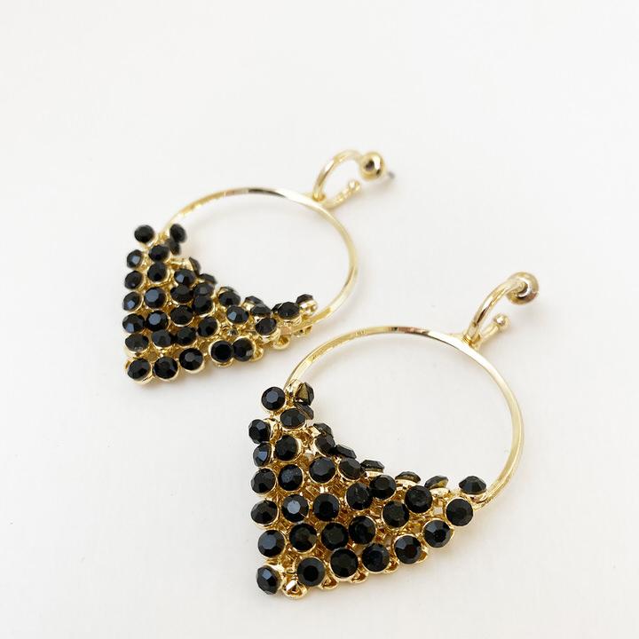 Caracol jewelry featuring a pair of crystal dangly earrings