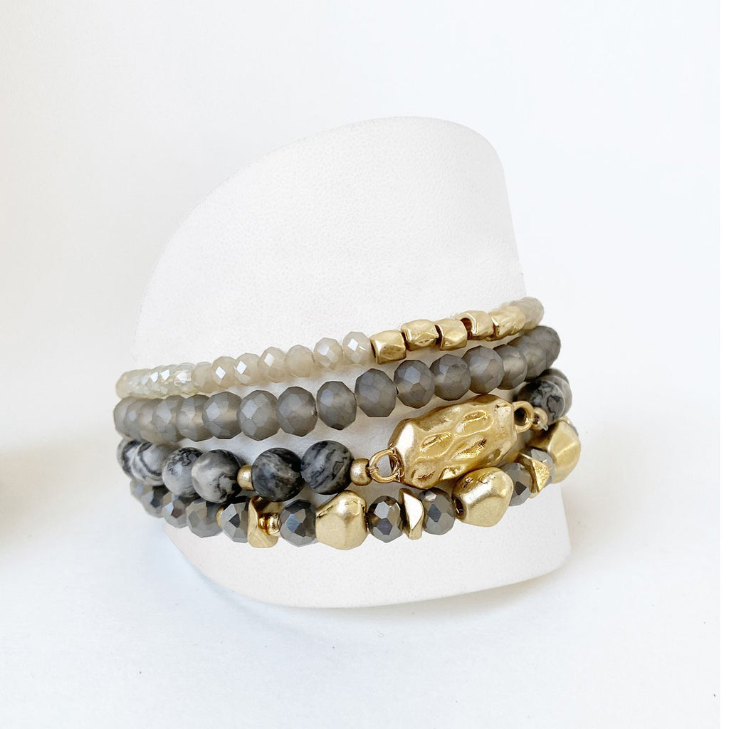 Caracol jewelry featuring a set of four bracelets with stones, glass and metal balls