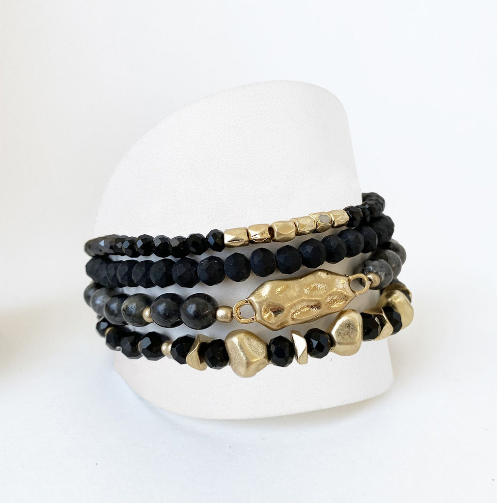 Caracol jewelry featuring a set of four bracelets with stones, glass and metal balls