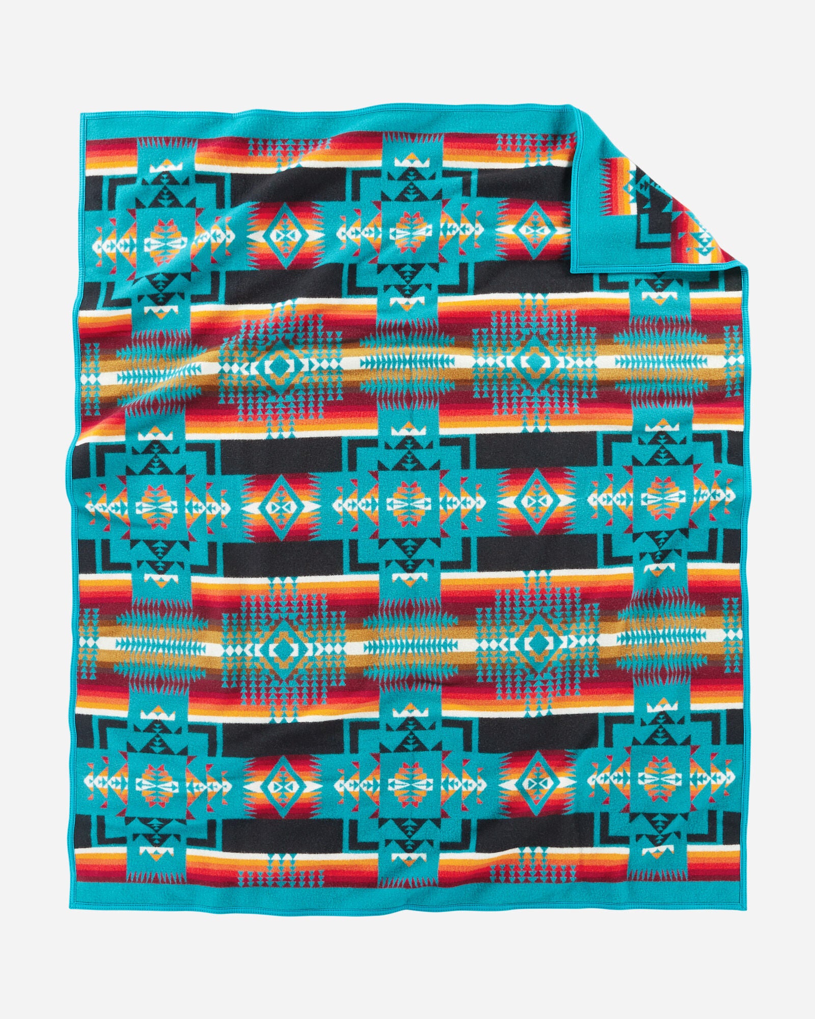 twin size reversible Pendleton wool blanket in turquoise with a bold arrowhead design