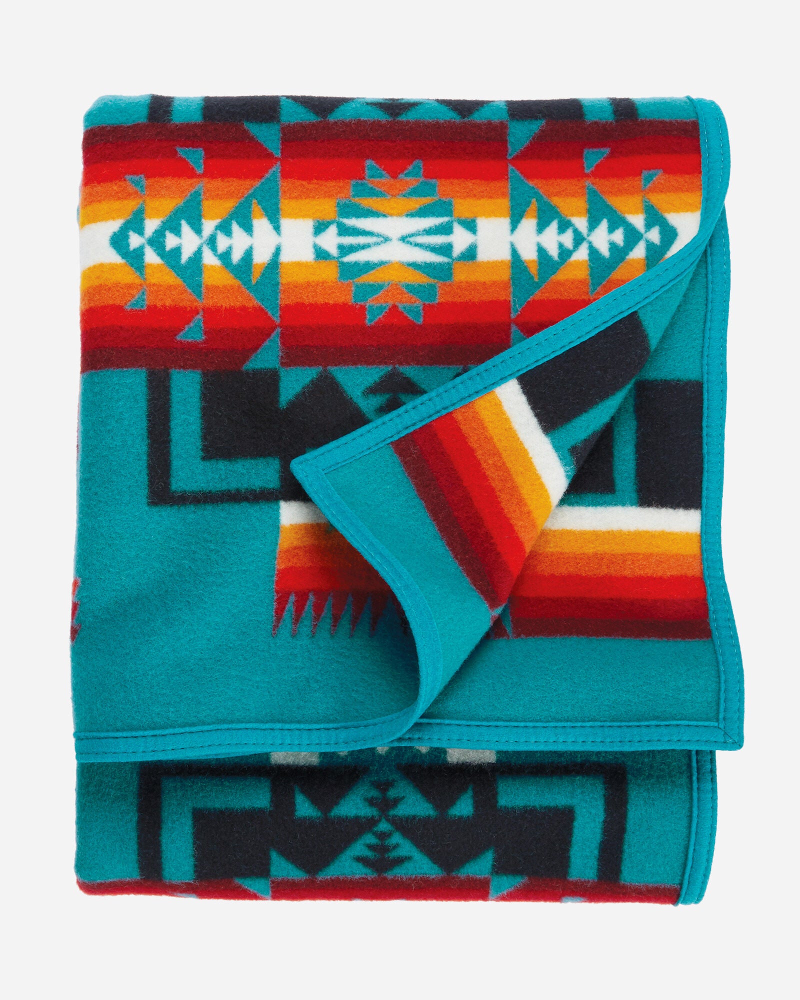 twin size reversible Pendleton wool blanket in turquoise with a bold arrowhead design