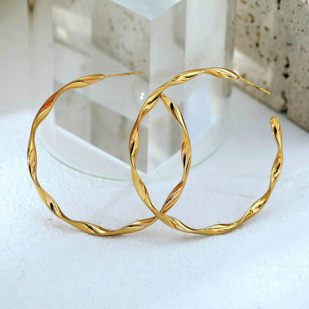 Hackney jewelry featuring gold hoop earrings. 