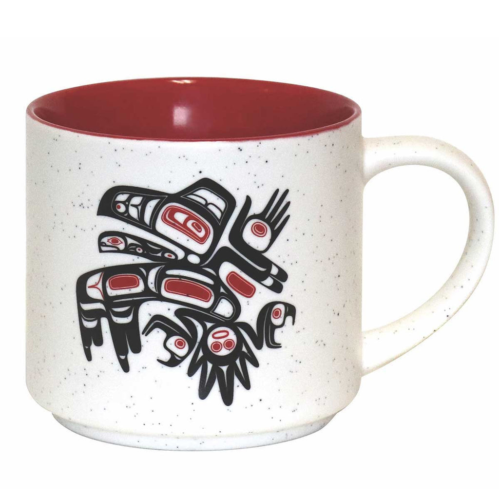 A ceramic coffee mug featuring an Indigenous design of eagles from the Bella Bella tribe